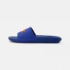 Lacoste CROCO SLIDE - Mules - Blu/org