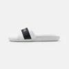 Lacoste CROCO SLIDE - Mules - White/navy